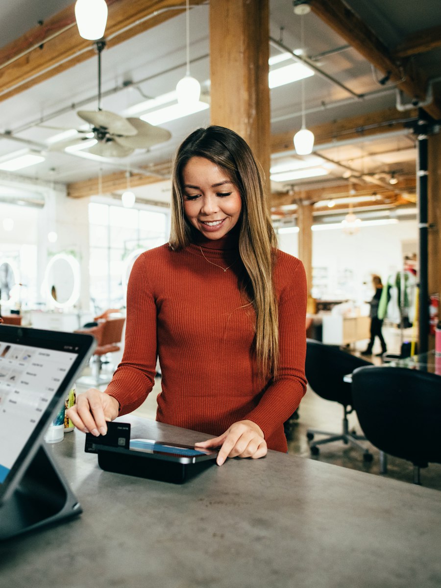 Shopper paying by card at the counter